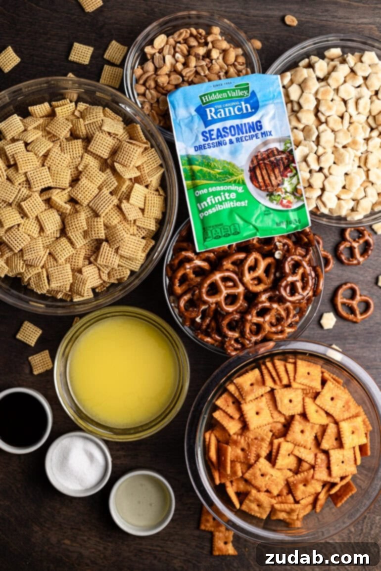 Every party needs something sweet, something salty, something light, and something indulgent. This ranch slow cooker Chex mix perfectly embodies both salty and addicting qualities, making it a truly essential party snack! Various bowls showcasing the individual components of this easy Chex mix recipe: crispy Chex cereal, salty pretzels, buttery oyster crackers, cheesy Cheez-Its, and roasted peanuts, neatly arranged alongside the liquid ingredients for the savory ranch seasoning blend. Get ready to mix and cook this crowd-pleasing snack!