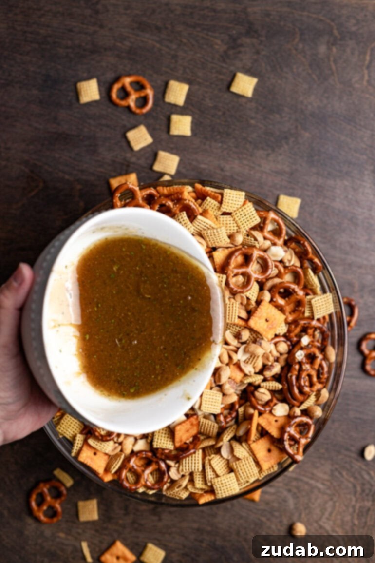 Whip Up Easy Ranch Chex Mix in Your Slow Cooker 5 Chex mix dry ingredients being mixed in a bowl