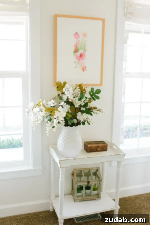 My New Office Tour 4 Detailed view of white Diamond Cabinets adorned with elegant Atlas Homewares Champagne hardware.