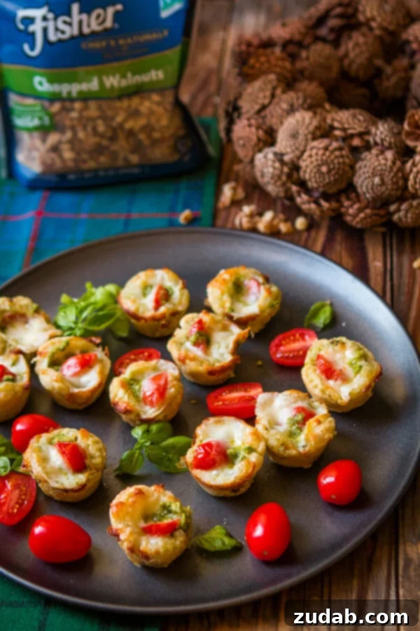 Speedy Cheesy Caprese Pesto Tarts 8 A beautifully plated Caprese salad featuring fresh mozzarella, ripe tomatoes, and fragrant basil leaves, with a drizzle of balsamic glaze, illustrating the key flavors of the tarts.