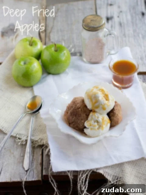 Sweet Skillet Apples 4 Finished deep fried apples generously coated in cinnamon sugar, arranged on a plate