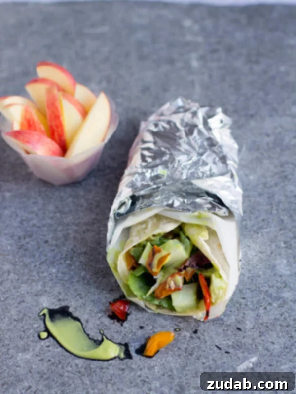 Close-up of a fresh Honey Avocado Wrap, highlighting the creamy Honey Avocado Dressing and vibrant fillings.