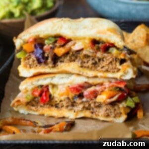 A perfectly cooked fajita style Mexican turkey burger on a bun.