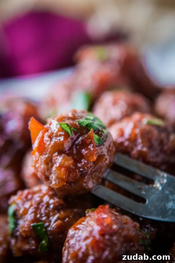 Sweet and Tangy Slow Cooker Chili Sauce and Grape Jelly Meatballs Appetizer