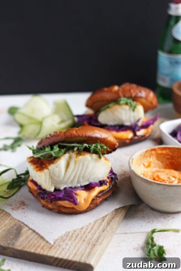 Sriracha Mayo Blackened Fish Burger: Fast & Delicious The full blackened fish burger ready to be enjoyed, showing off the sriracha mayo and colorful cabbage.