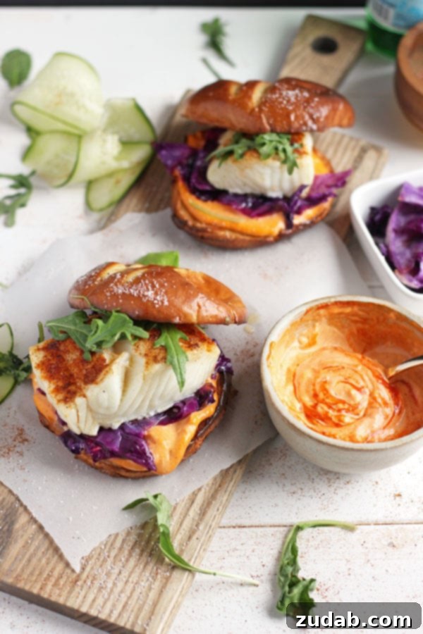 Weeknight Blackened Fish Burger with Sriracha Mayo A top-down view of the blackened fish burger, emphasizing its hearty and appetizing appeal.
