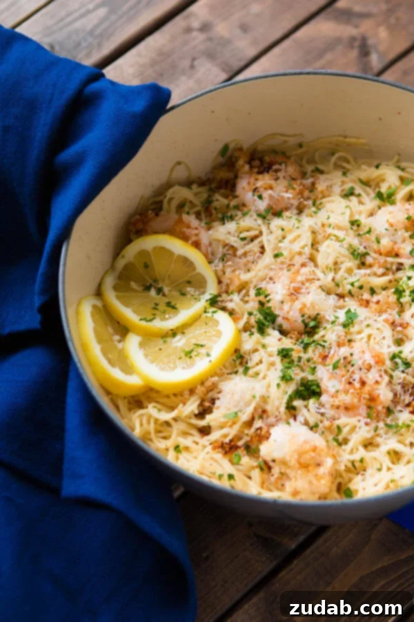One-Pot Comfort Food A serving of one pot breaded parmesan shrimp scampi pasta in a bowl. ohsweetbasil.com