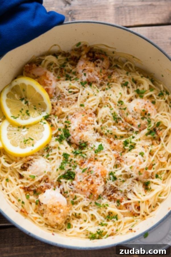 Ready to Serve Full spread of the one pot breaded parmesan shrimp scampi pasta with fresh parsley garnish. ohsweetbasil.com