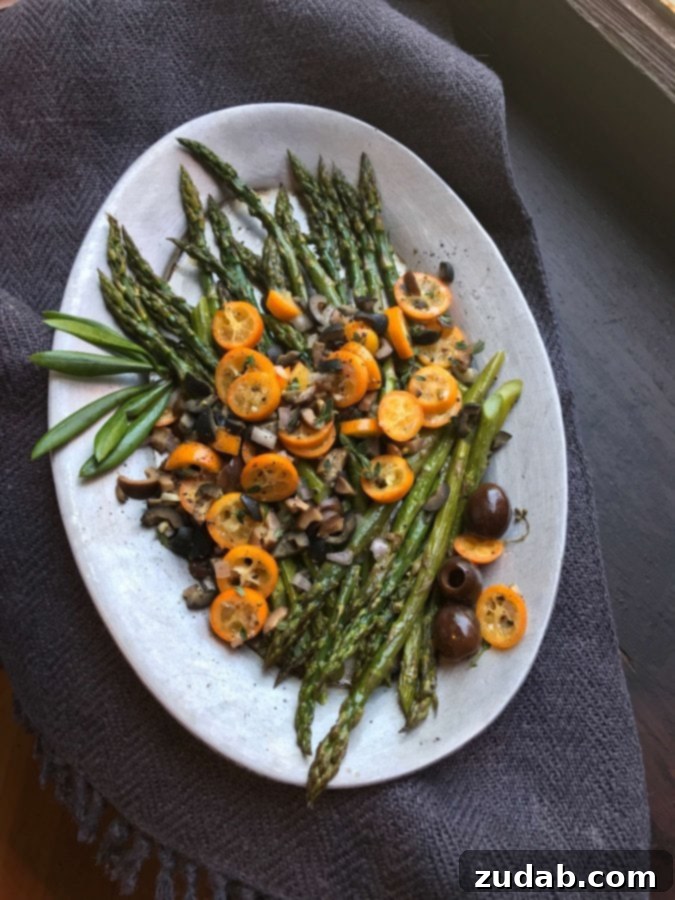 Gooey Cheese Stuffed Mediterranean Chicken 4 A fresh and colorful side dish of asparagus paired with ripe olives and zesty kumquats, a perfect complement to any Mediterranean meal.
