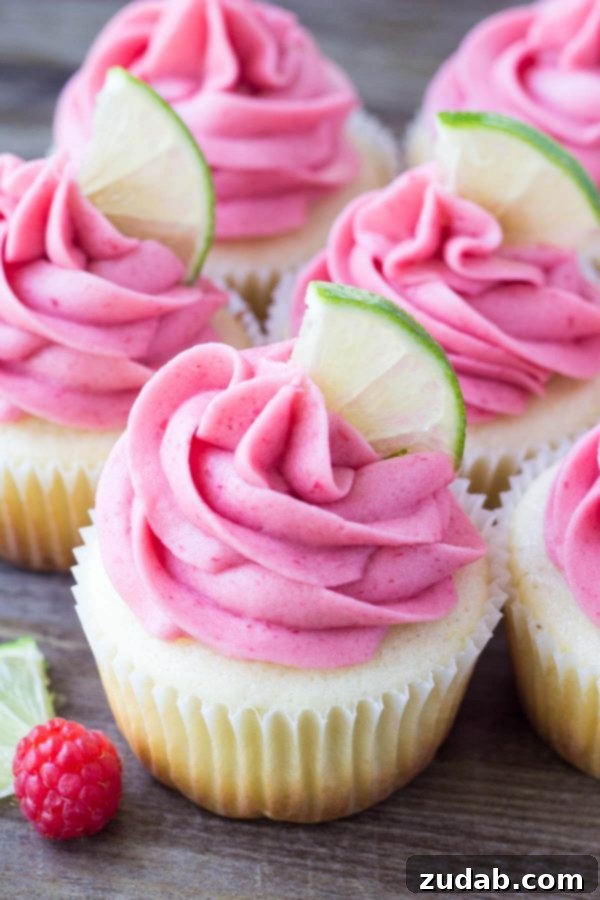 A close-up of Raspberry Lime Cupcakes, highlighting the delicate frosting and fresh berry notes. Beautifully frosted Raspberry Lime Cupcakes showcasing their vibrant colors and appealing texture.