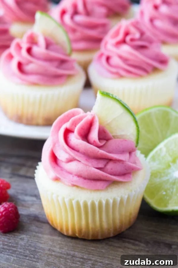 Close-up of the delicate raspberry frosting on a lime cupcake. Overhead view of Raspberry Lime Cupcakes with intricate frosting swirls.
