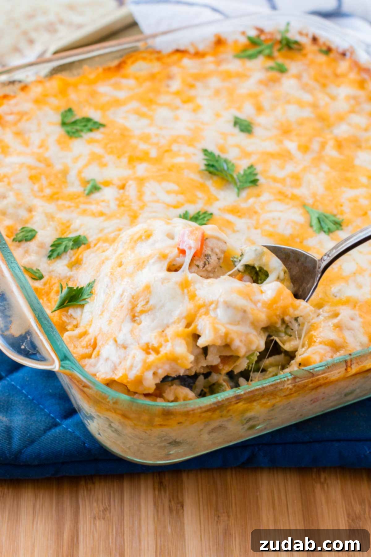 Cheesy Chicken and Rice Casserole: Your new favorite quick and easy dinner idea, perfect for busy weeknights and satisfying cravings. A bubbling pan of golden-brown cheesy chicken and rice casserole, fresh from the oven, ready to be served for a quick and easy family dinner.