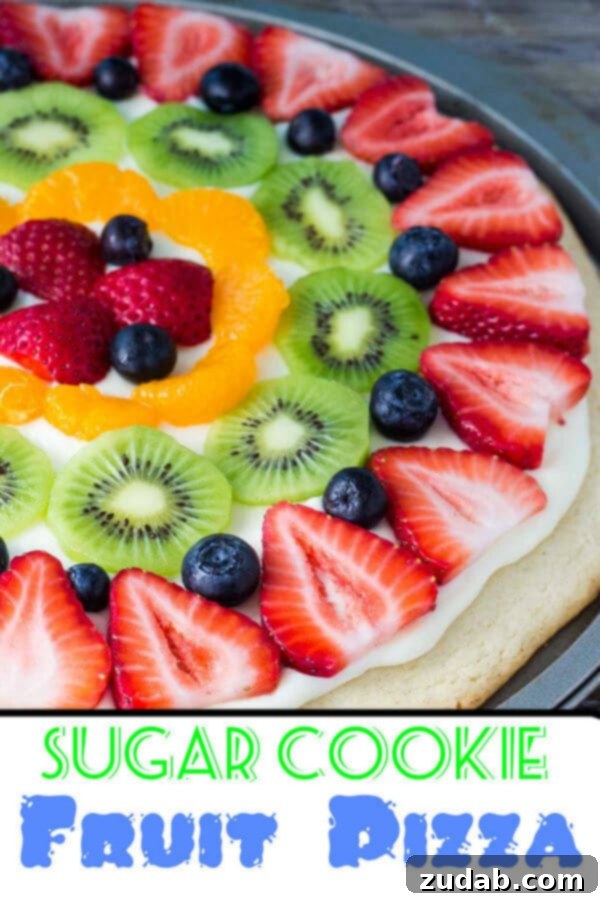 Vibrant Fruit Cookie Pizza 3 This sugar cookie fruit pizza is the perfect spring or summer dessert! Topped with tangy cream cheese frosting and fresh fruit, it looks and tastes absolutely delicious!