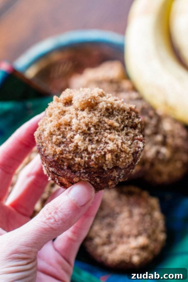 Soft and delicious Brown Sugar Grain-Free Zucchini Muffins, made with organic ingredients for a wholesome breakfast. A batch of freshly baked Brown Sugar Grain-Free Zucchini Muffins with a sweet topping, ready for an organic breakfast.