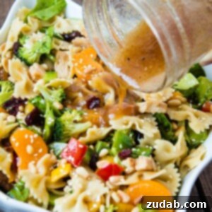 Teriyaki Chicken Pasta Salad with vibrant vegetables, mandarin oranges, and sesame dressing.