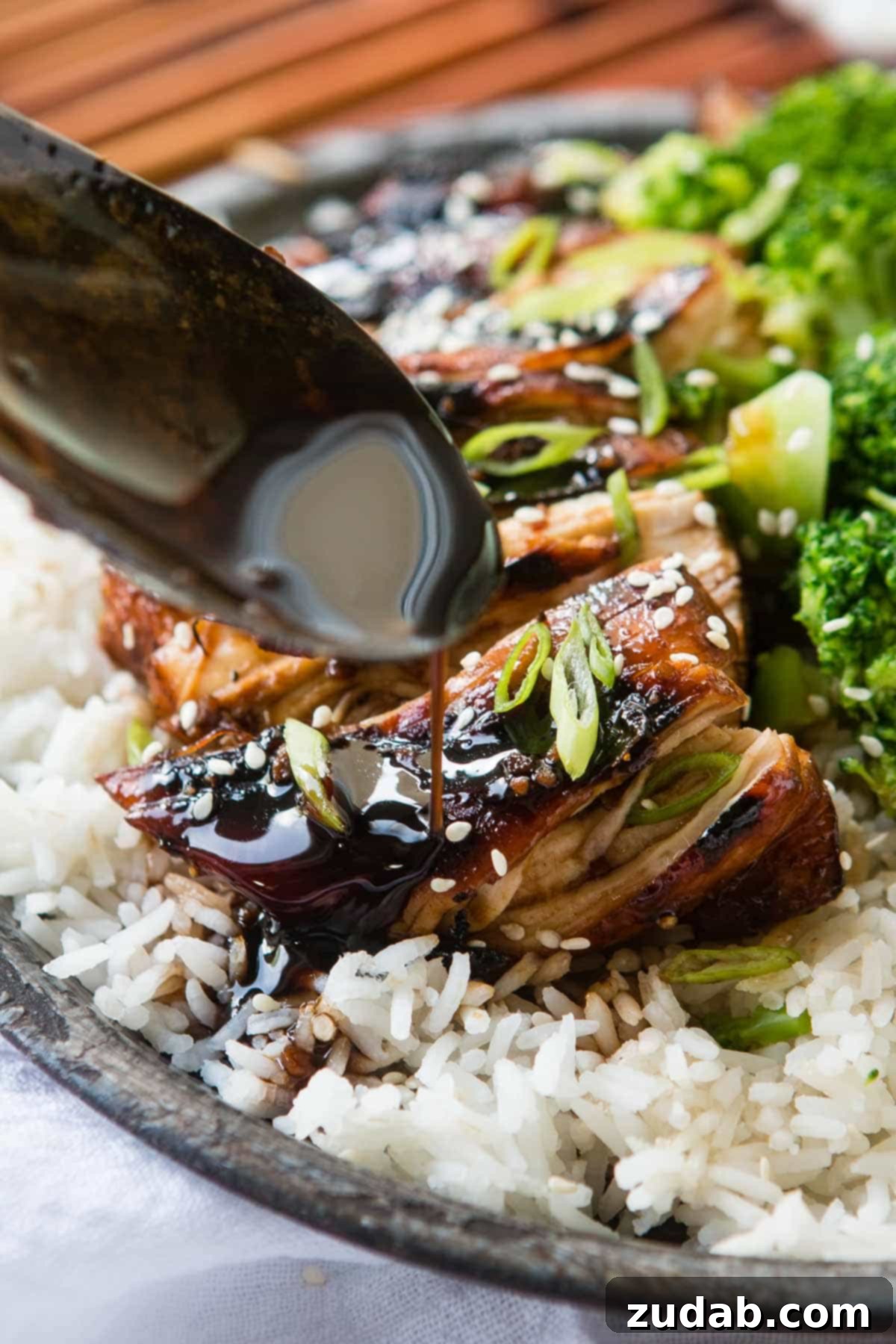 Irresistible Sticky Asian Grilled Chicken Breasts served over rice, featuring a rich soy and sweet chili sauce.