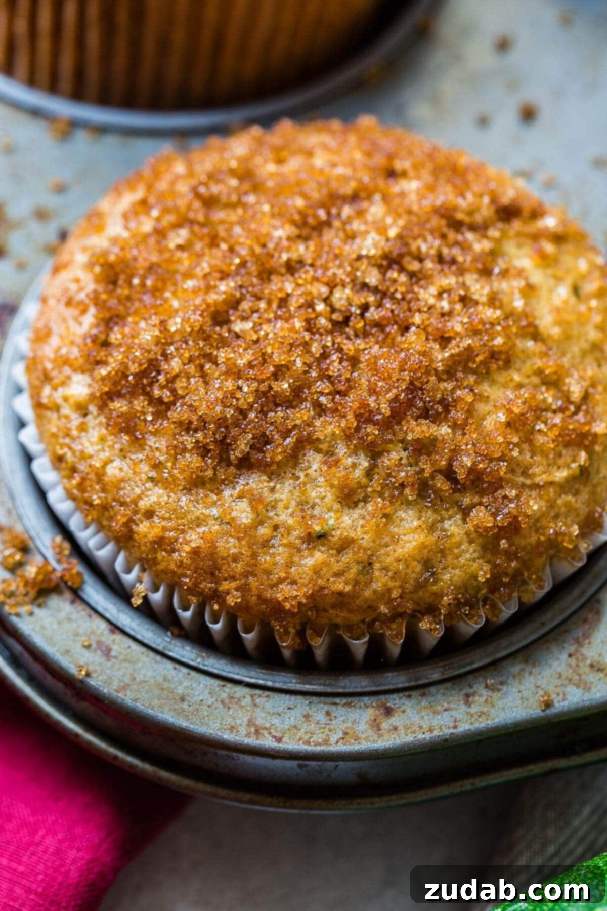 Mom's best zucchini muffins only need a few ingredients but the sour cream is the most important part. Looking for recipe ideas using zucchini? Make these muffins! zucchini bread muffin topped with cinnamon-sugar topping in muffin tin