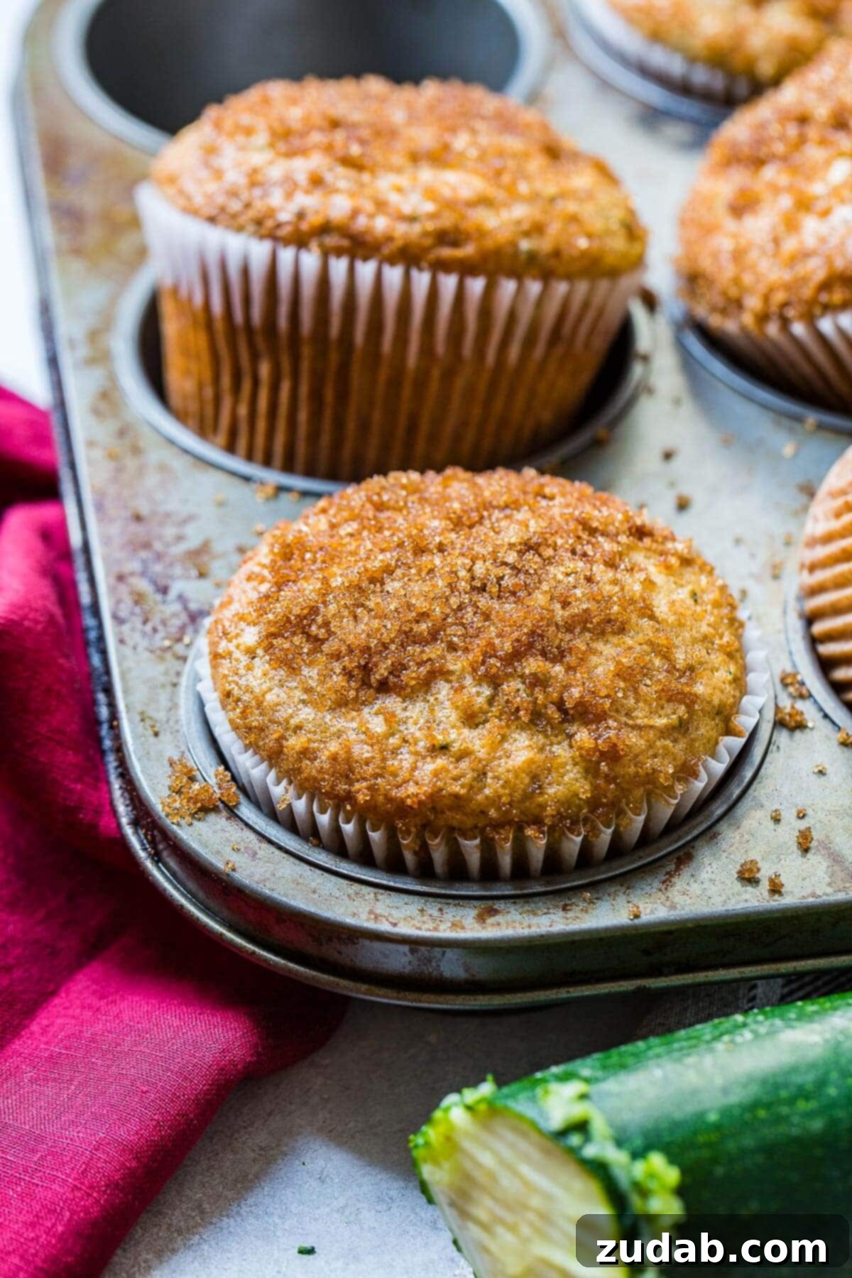 Mom's best zucchini muffins only need a few ingredients but the sour cream is the most important part. Looking for recipe ideas using zucchini? Make these muffins! easy zucchini muffins in muffin tin