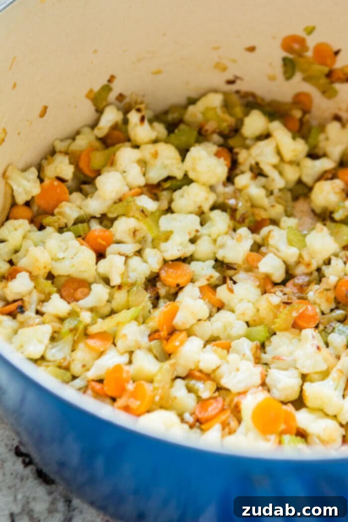 Easy One Pot Cauliflower Chowder 12 Start out by cooking the carrots, onion, celery and cauliflower until tender. Make sure you don't add the garlic until the very end to avoid burning. ohsweetbasil.com
