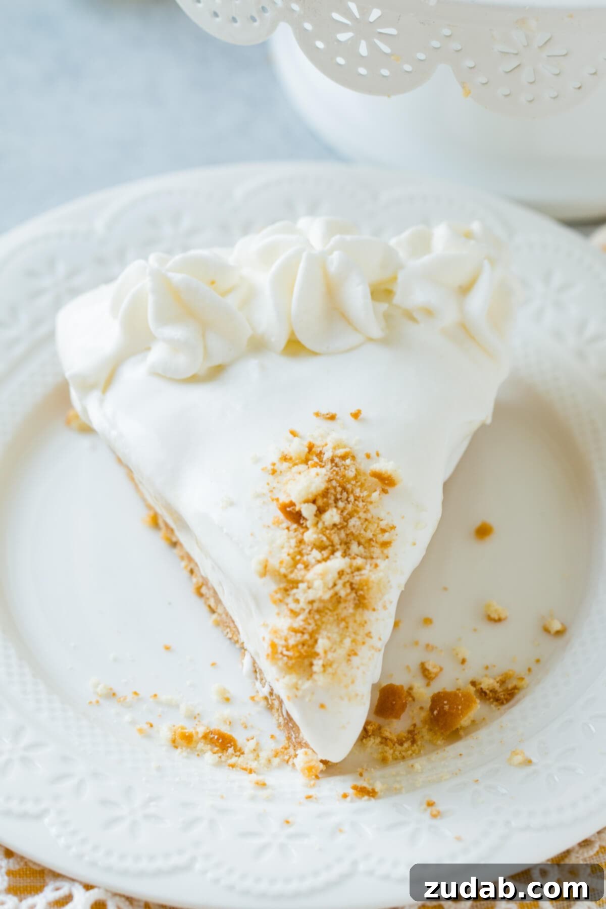 Dreamy No-Bake Banana Pudding Cheesecake 5 slice of banana cream cheesecake on white plate