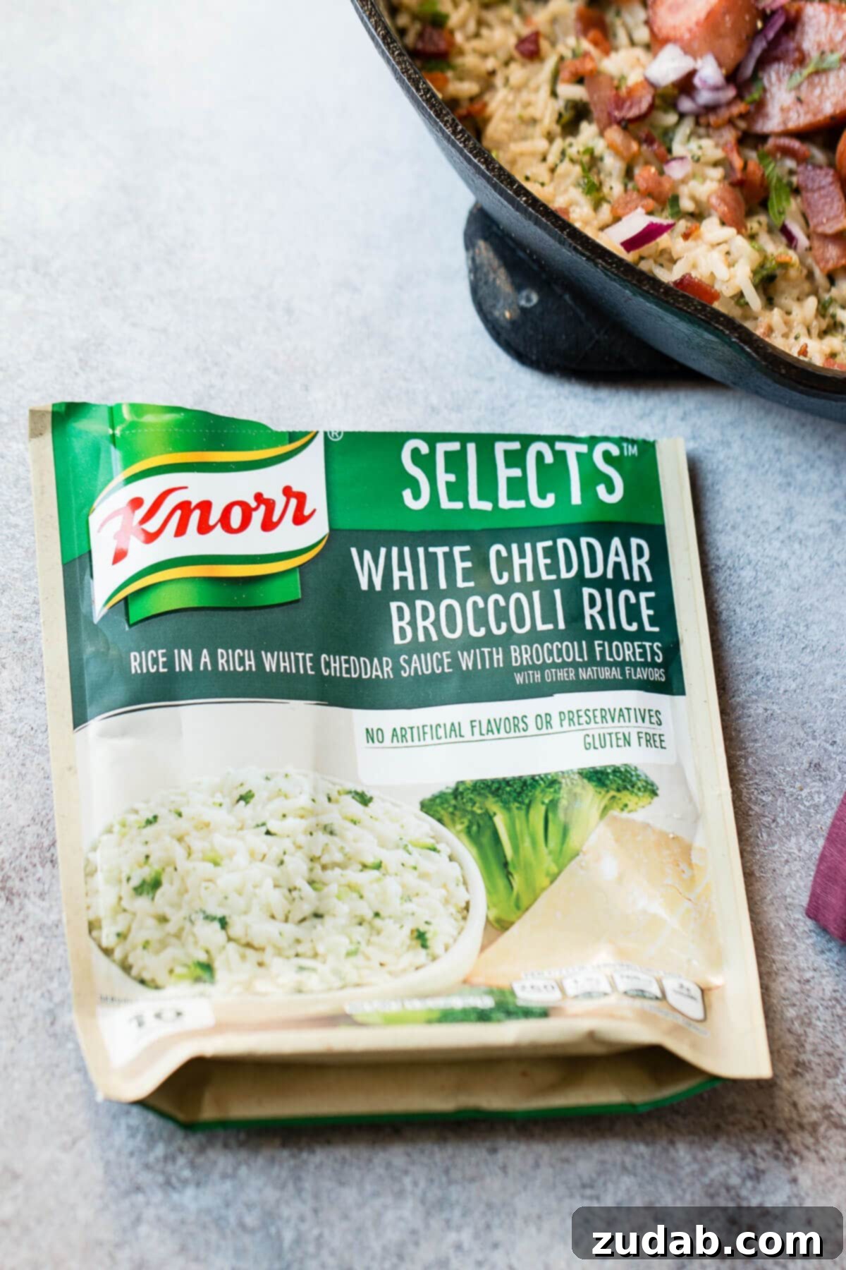 One Pan Cheesy Kielbasa Broccoli Rice 3 Knorr Selects White Cheddar Broccoli Rice forms the perfect base for our easy kielbasa skillet dinner.