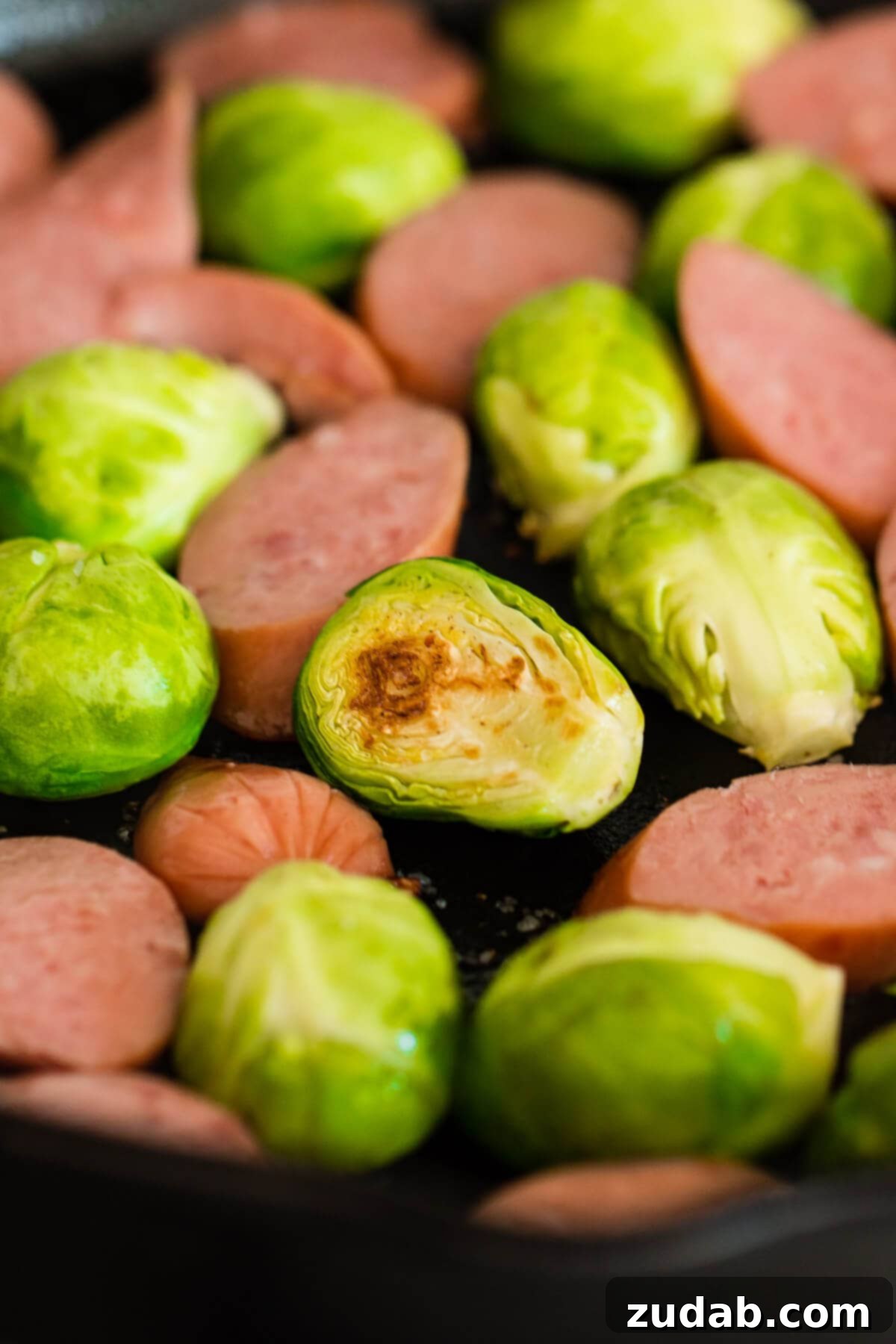 One Pan Cheesy Kielbasa Broccoli Rice 5 The secret to really good Brussels sprouts is to cook them in a little bacon fat in a skillet.