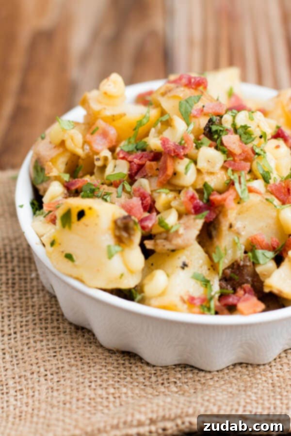 Smoky Creamy Bacon Potato Sensation 4 Overhead shot of a bowl of delicious homemade Bacon Potato Salad, garnished with fresh parsley.