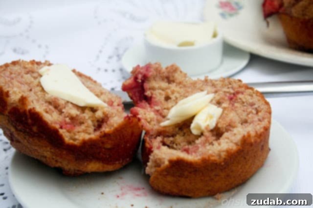Sweet Strawberry Muffins 3 Close-up of freshly baked whole wheat strawberry muffins, showcasing their golden-brown tops and moist interior.
