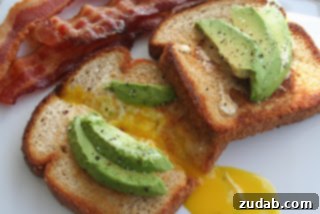 Thoughtful Ways to Celebrate Mom 5 Golden brown California Toad In A Hole with a perfectly cooked egg in the center and fresh herbs