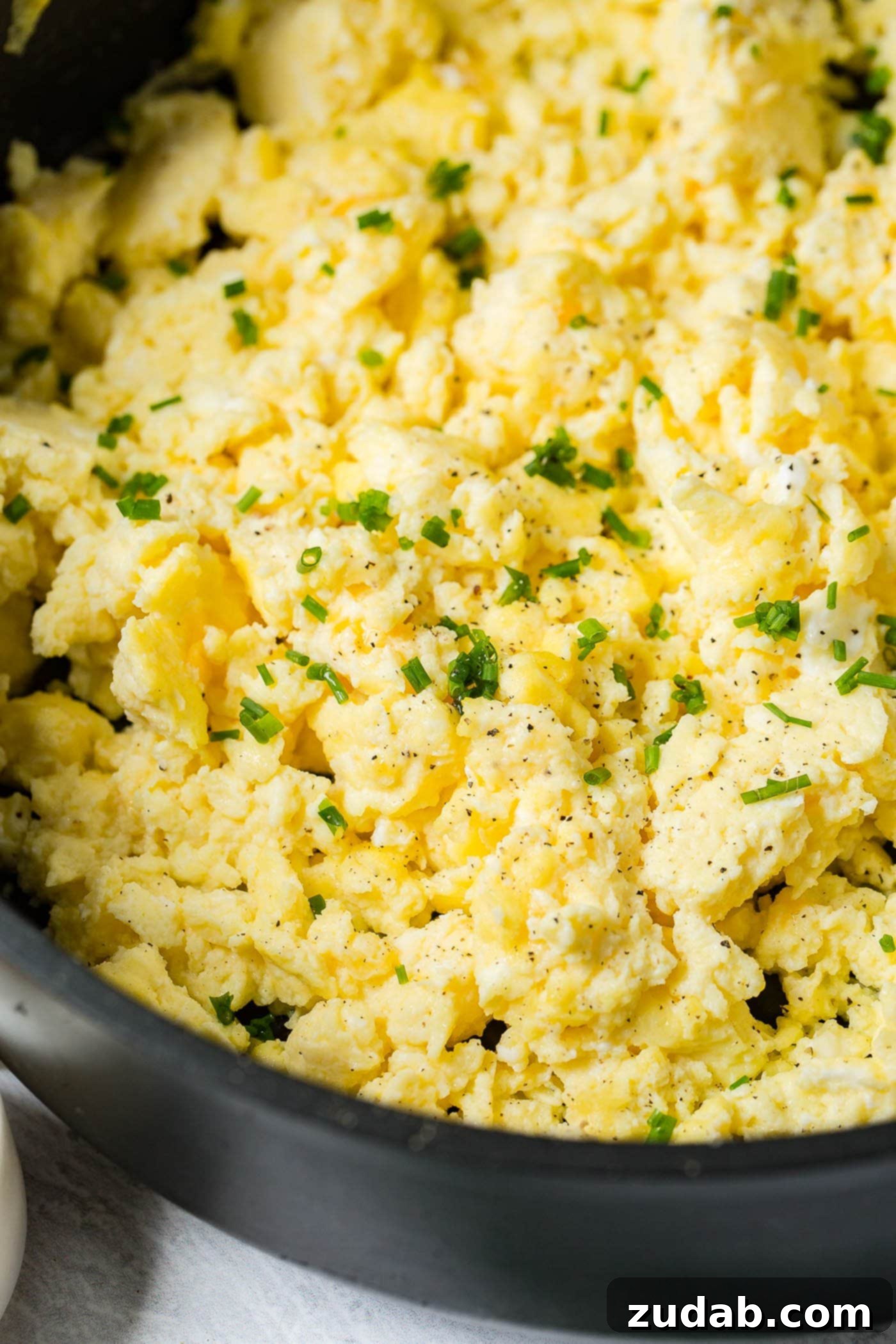 The Best Scrambled Eggs Perfectly scrambled eggs sprinkled with sliced green onion.