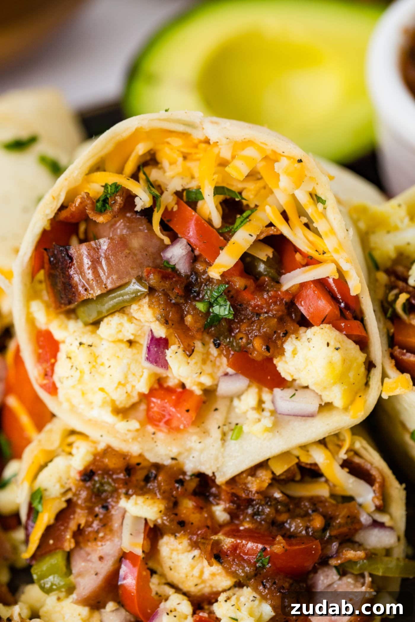 Spiced Apple Sausage Morning Wraps 2 An apple chicken sausage burrito stuffed full of sausage, eggs, peppers, and cheese.