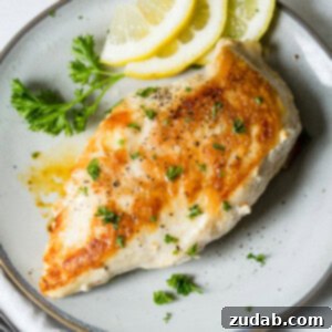 Perfectly Pan-Seared Chicken 7 Perfectly cooked pan-seared chicken breast on a plate.