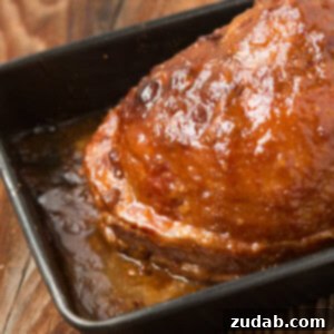 Southern Glazed Ham. Seriously the best glaze ever and you won't believe what the ingredients are! Discover this crunchy, sweet, and savory holiday ham recipe.
