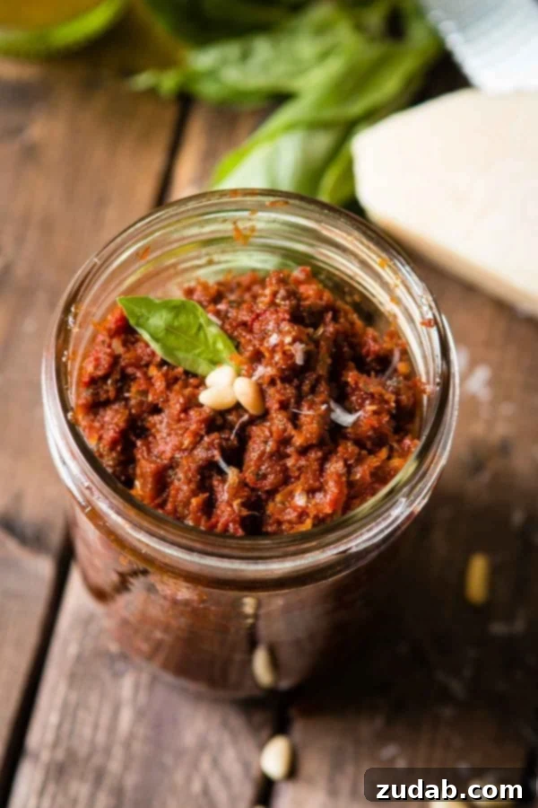 Making Sun-Dried Tomato Pesto from scratch Homemade Sun-Dried Tomato Pesto in a food processor, ready for blending