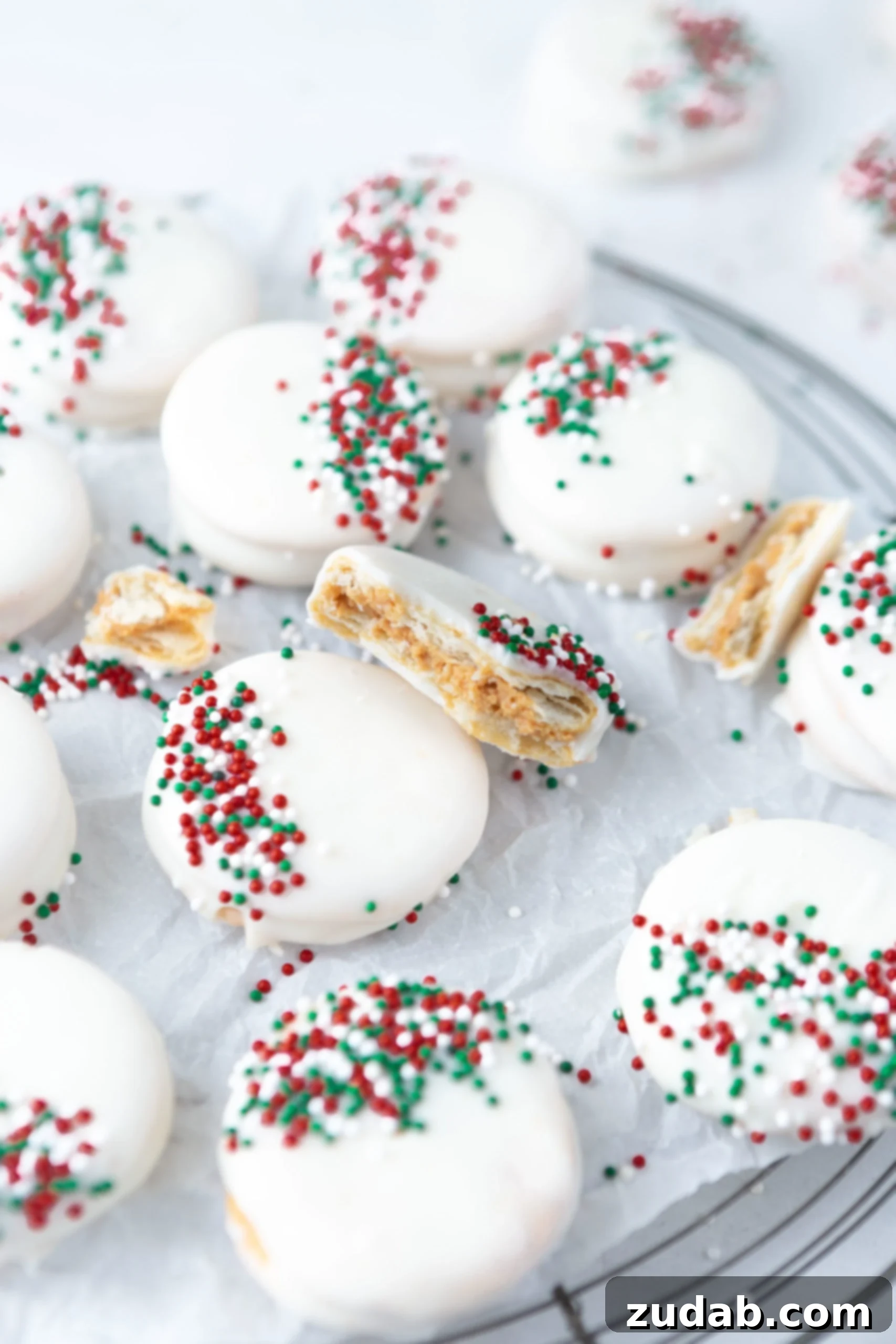 White Chocolate Peanut Butter Crackers The easiest kid friendly holiday candy to make, peanut butter filled ritz crackers then dipped in white chocolate and sprinkles!