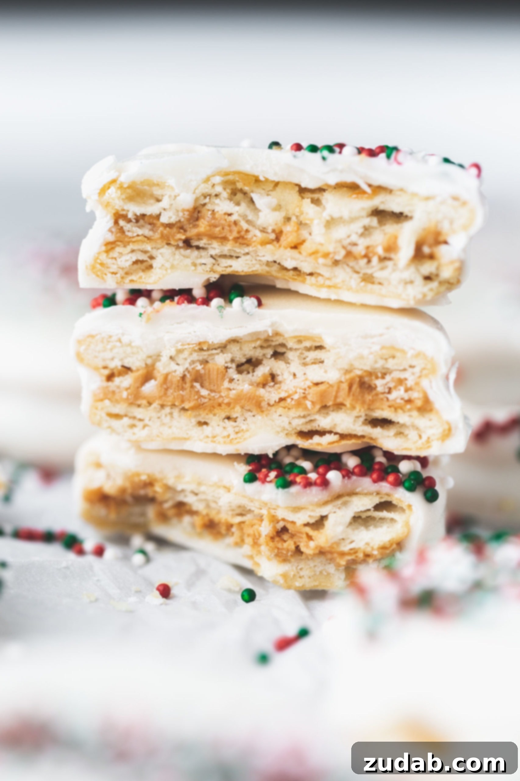 White Chocolate Peanut Butter Crackers The easiest kid friendly holiday candy to make, peanut butter filled ritz crackers then dipped in white chocolate and sprinkles!