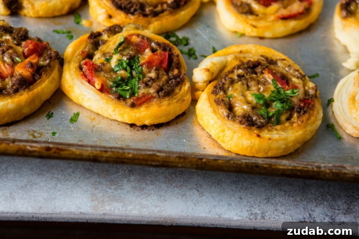Taco Pinwheels Recipe A Visual Guide 2 Oh Taco Pinwheels, I can't stop, wont stop!! All you need is puff pastry, taco meat, tomatoes and cheese plus a few bowls of toppings like guacamole! ohsweetbasil.com