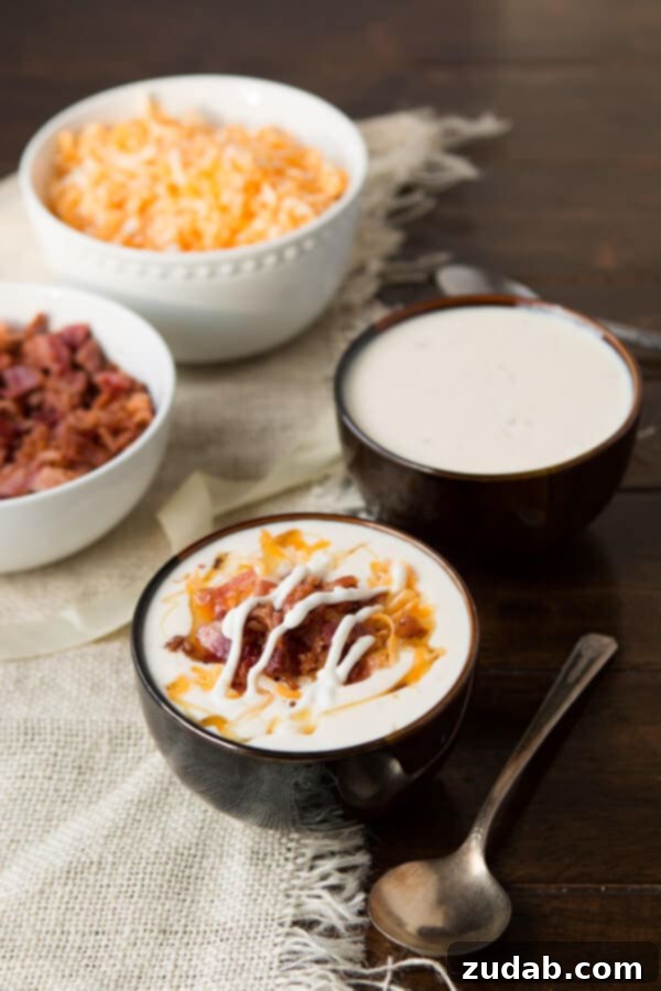 Golden Loaded Baked Potato Soup - Creamy and Delicious Golden Loaded Baked Potato Soup: A hearty and delightful soup recipe made with tender Yukon Gold potatoes, perfect for any season. Get the recipe at ohsweetbasil.com.