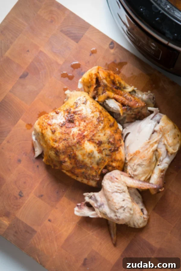 This is the easiest way to enjoy a juicy, rotisserie like chicken by only using a crockpot. Slow cooker whole chicken that anyone can make! insta pot, pressure cooker Pulling apart Slow Cooker Whole Chicken.