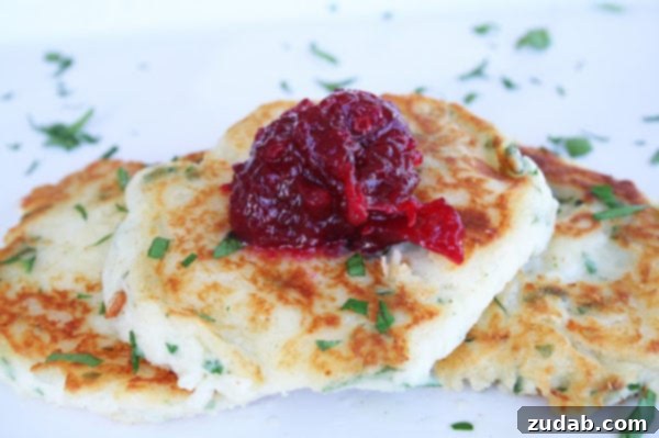 Thanksgiving Leftovers Reimagined 3 Crispy and golden mashed potato pancakes served with a vibrant cranberry chutney.