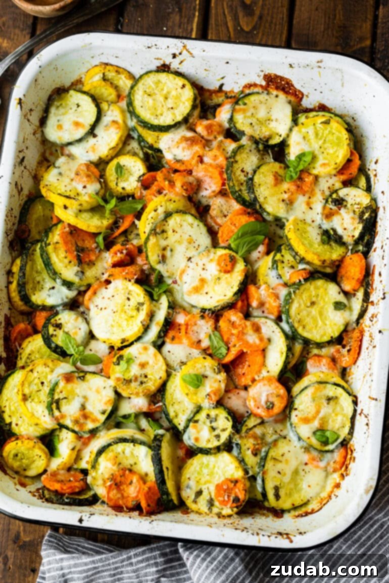 Savory Parmesan Basil Roasted Veggies 5 a photo of a large baking dish filled with roasted cheesy basil vegetables