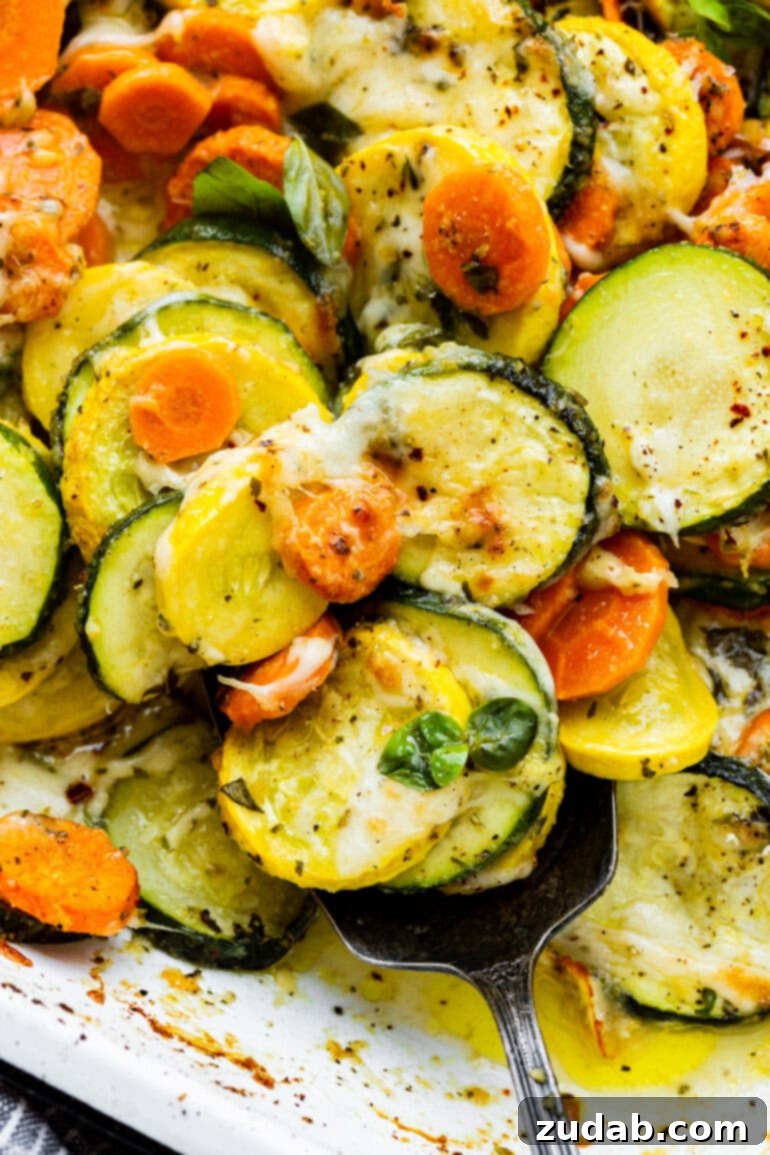 Savory Parmesan Basil Roasted Veggies 6 a closeup photo of melted cheese covered roasted vegetables