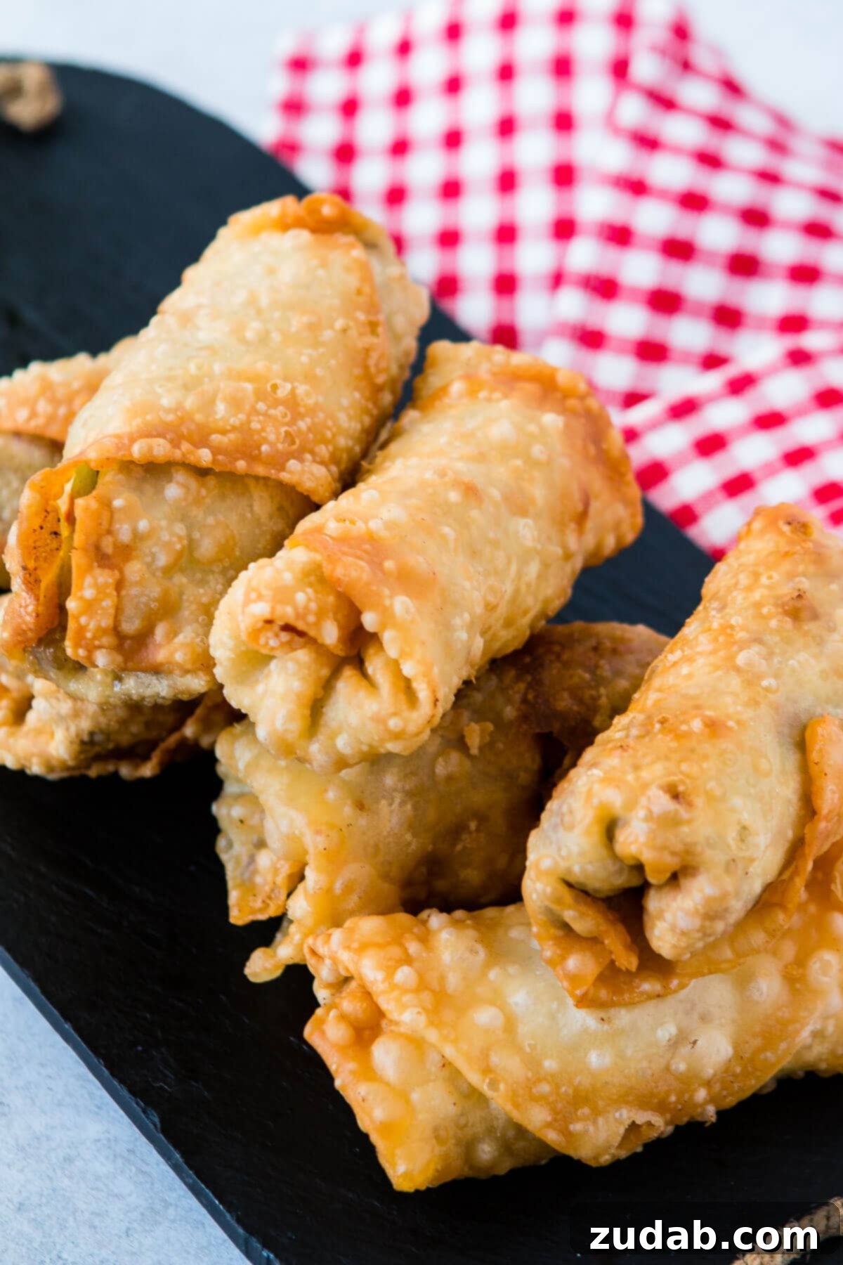 Crispy Philly Cheesesteak Egg Rolls 3 The ultimate game day appetizer: Philly Cheesesteak Egg Rolls, crispy and flavorful, a definite win for any party.