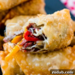 Crispy Philly Cheesesteak Egg Rolls 7 Who wouldn't love a crisp, fried egg roll full of meat and cheese? These Philly Cheesesteak Egg Rolls are perfect for football games and parties!