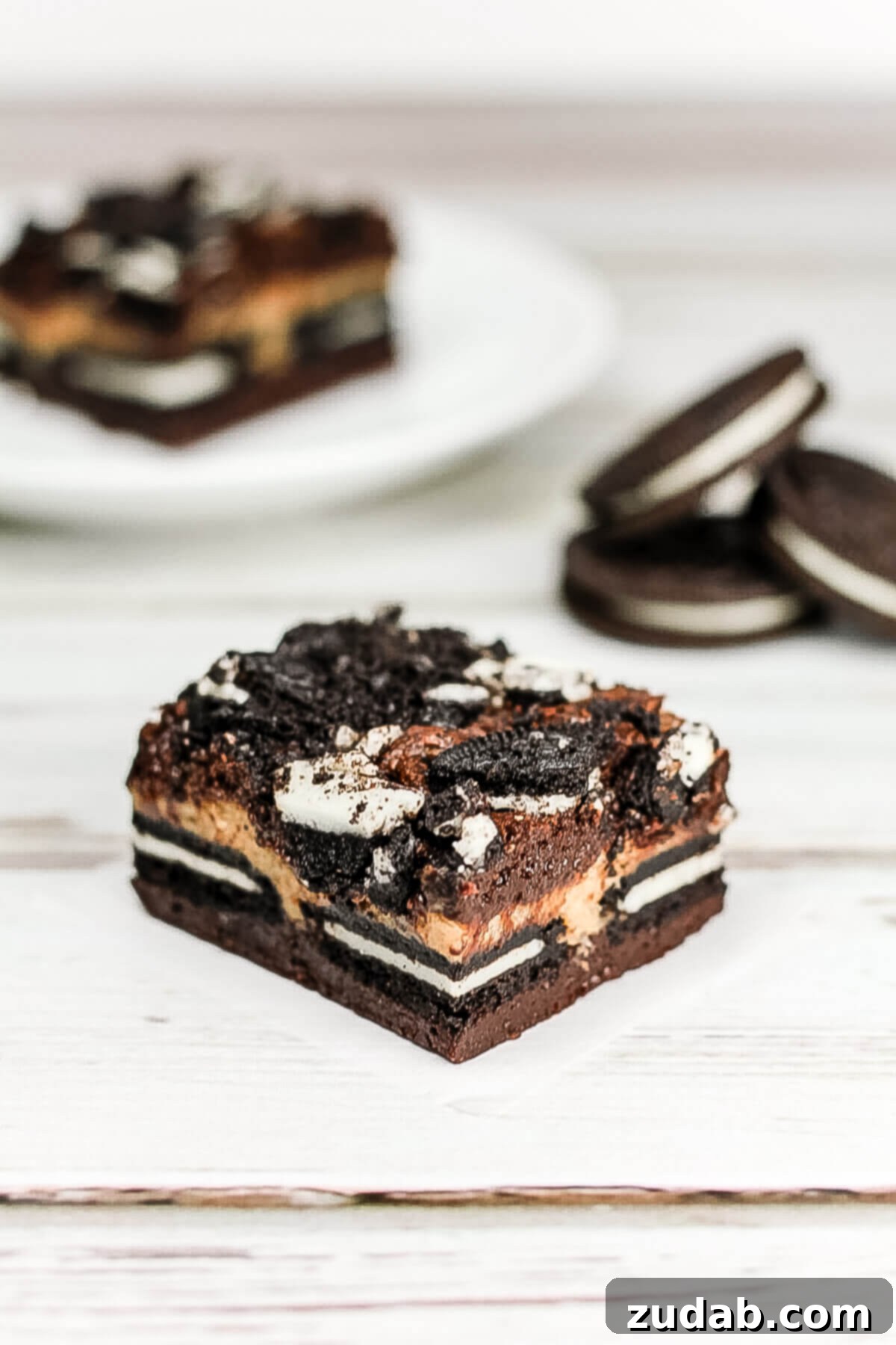 Decadent Peanut Butter Oreo Cheesecake Brownies 4 Delicious, multi-layered Peanut Butter Cheesecake Oreo Brownies ready to be enjoyed
