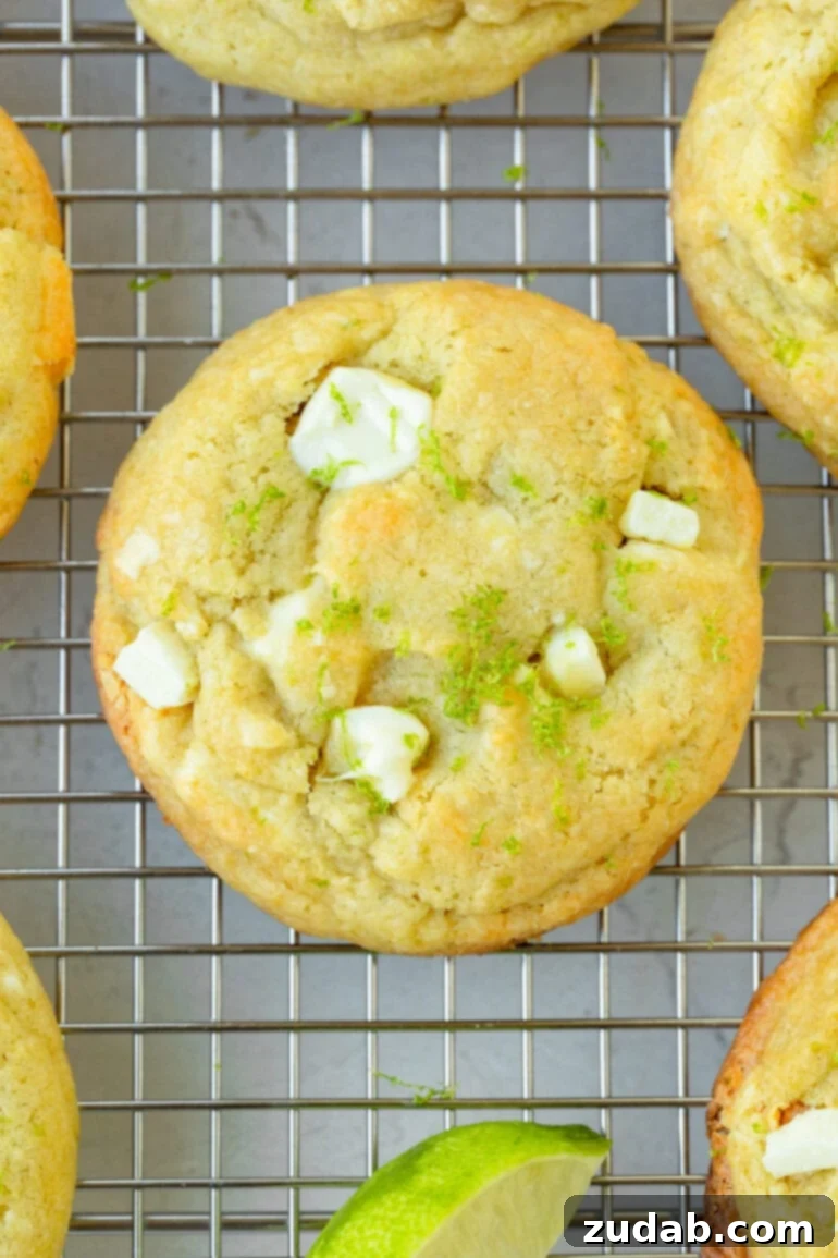 Zesty White Chocolate Key Lime Cookies 5 a photo of a golden baked cookies full of creamy white chocolate chunks and topped with lime zest.