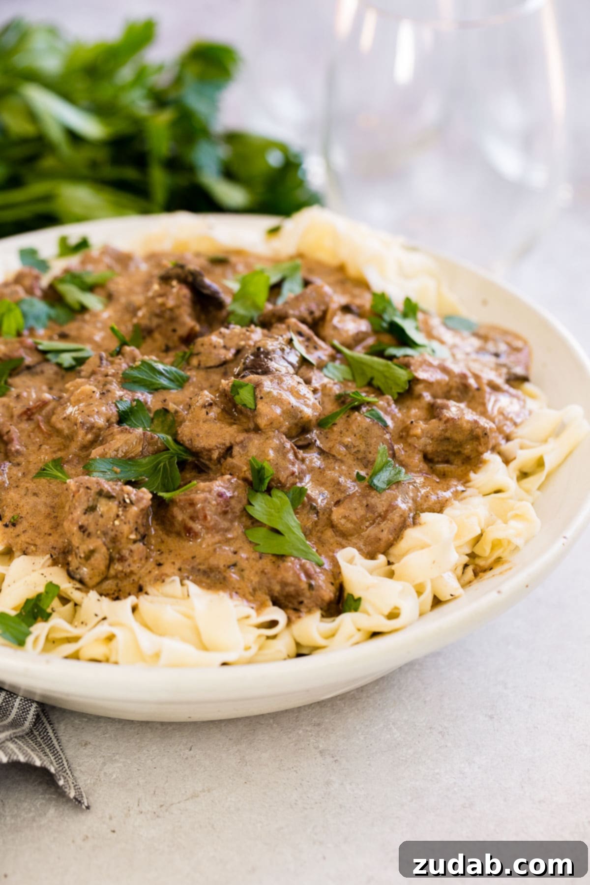 Effortless Instant Pot Beef Stroganoff 4 bowl of pasta topped with instant pot stroganoff