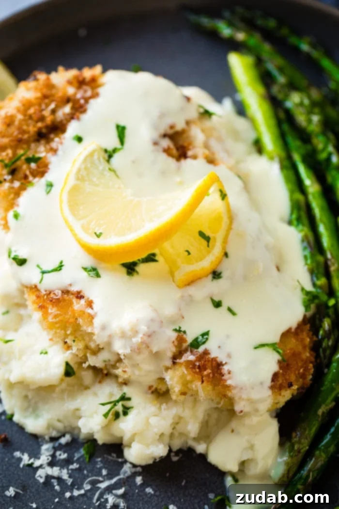 Golden Panko Chicken with Bright Lemon Cream 4 panko crusted chicken topped with lemon sauce and lemon slice