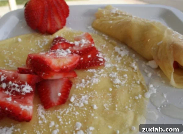 Sunshine Lemon Crepes 2 Delicious homemade lemon crepes with fresh berries and lemon syrup.