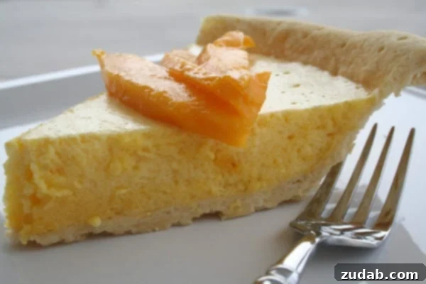 Sunshine Mango Cloud 2 Delicious and refreshing Mango Chiffon Pie, perfect for summer gatherings and tropical dessert lovers.